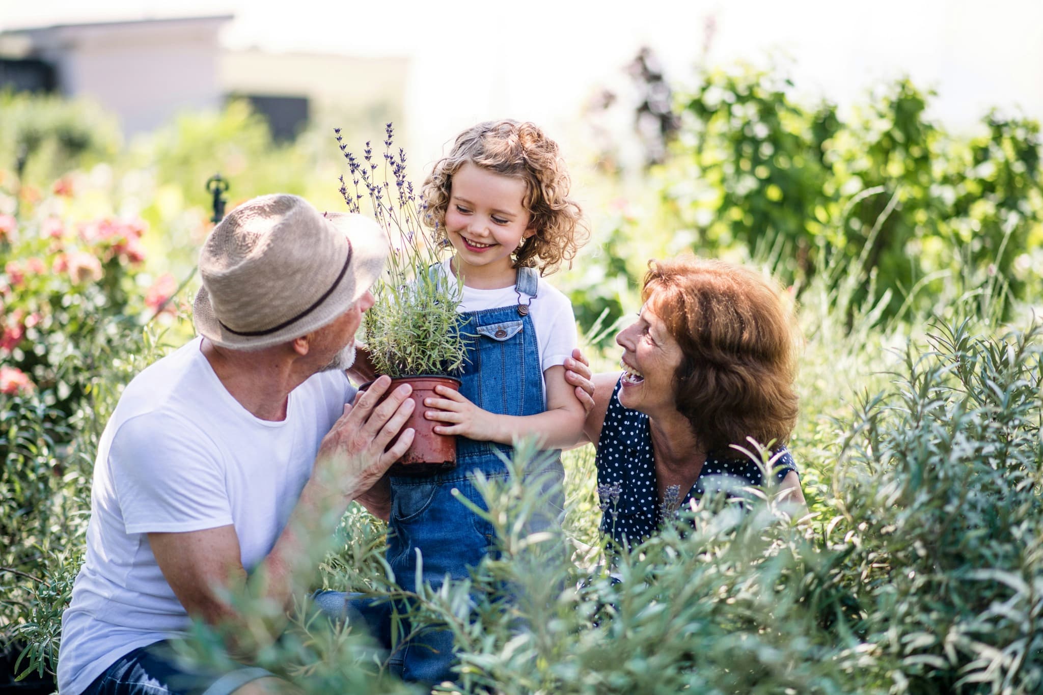 Family gardening outdoors, reflecting long-term mobility goals for knee care