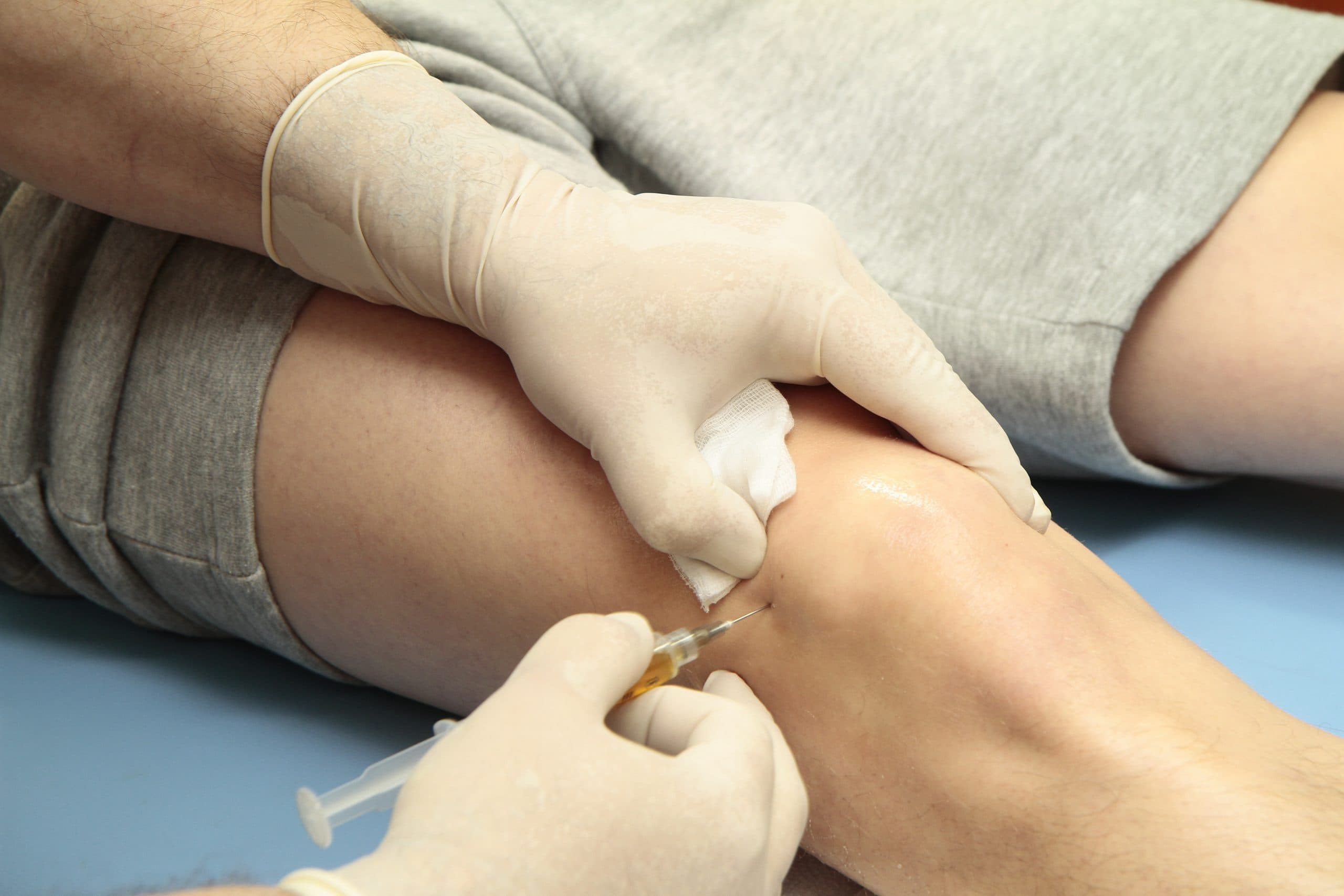 Close-up of a medical knee injection